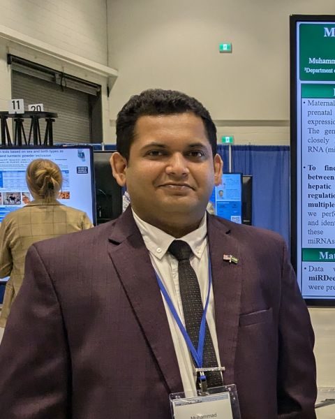 At his poster on factor analysis and Bayesian network learning, scientific conference (shared by NDSU Animal Sciences, 2025)